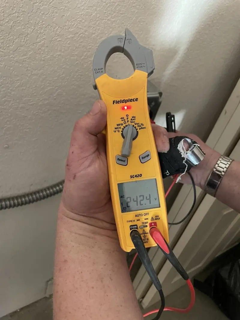 Voltage testing with clamp meter during Ceiling Fan Installation in Westtown